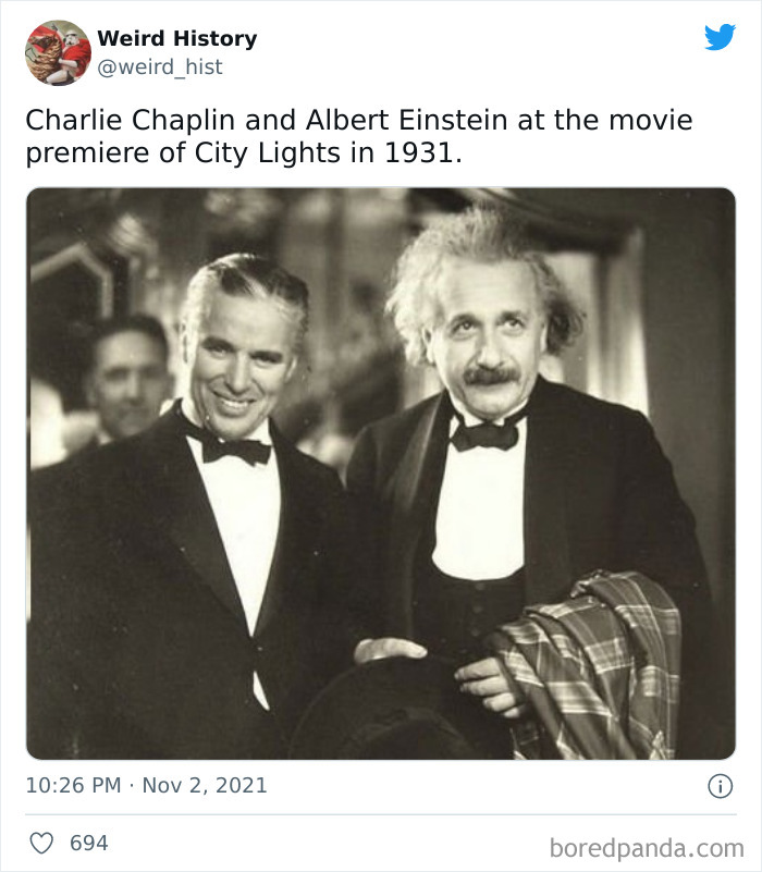 Black and white photo of Charlie Chaplin and Albert Einstein dressed formally at a 1931 movie premiere, weird history moment.