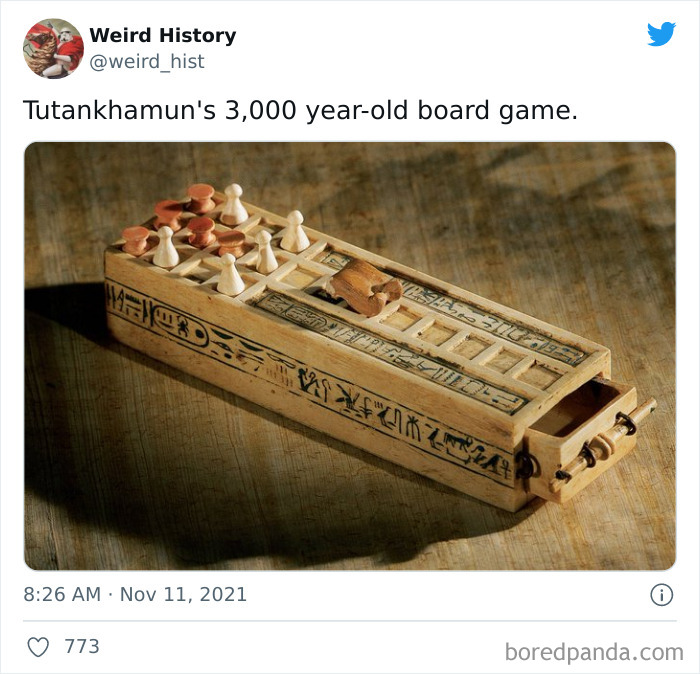 Ancient wooden board game from Tutankhamun's era featuring carved pieces and hieroglyphics, showcasing weird history.