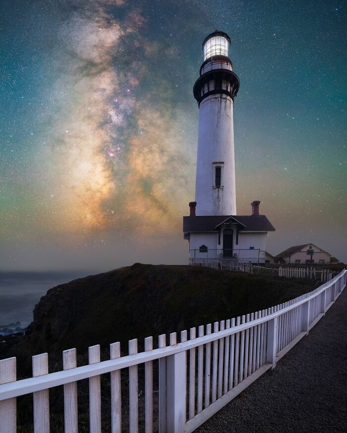 Lighthouse under a vibrant night sky, showcasing a stunning nightscape.