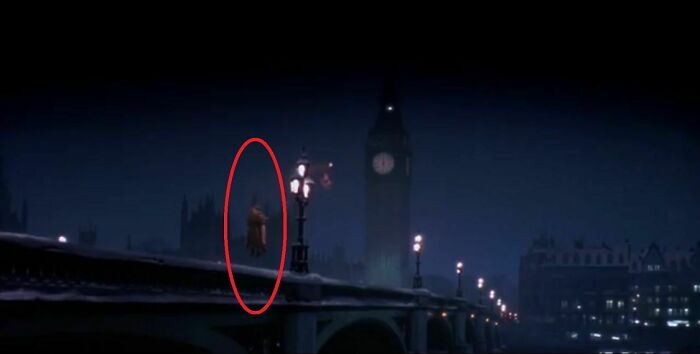 Scene from a film showing a hidden Easter egg detail with a floating figure on a bridge near Big Ben at night.