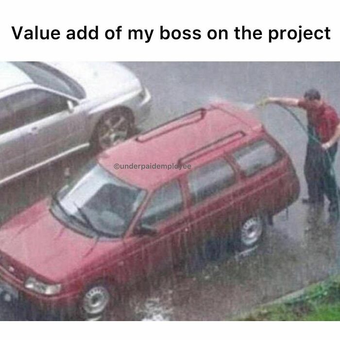 Person using a hose to wash a car in the rain, illustrating a meme for underpaid employees.