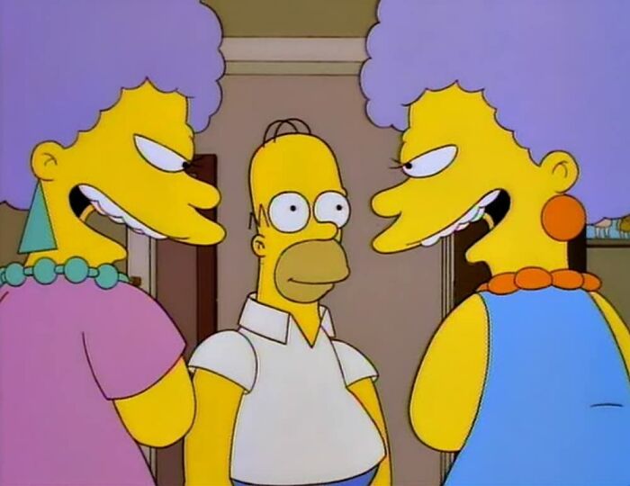 Homer Simpson standing between two angry women with purple hair, a scene highlighting The Simpsons fan theories.
