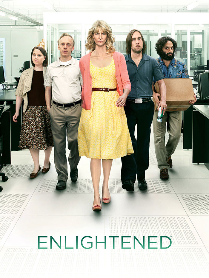 Characters from HBO's "Enlightened" walking confidently through an office setting.