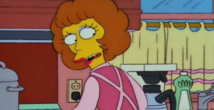 Woman character from The Simpsons in a kitchen setting, highlighting small details fans noticed about Homer in the show.