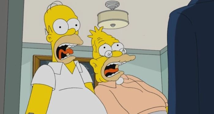 Homer and Grandpa Simpson shocked watching TV, highlighting Simpsons fans noticing small show details and theories.