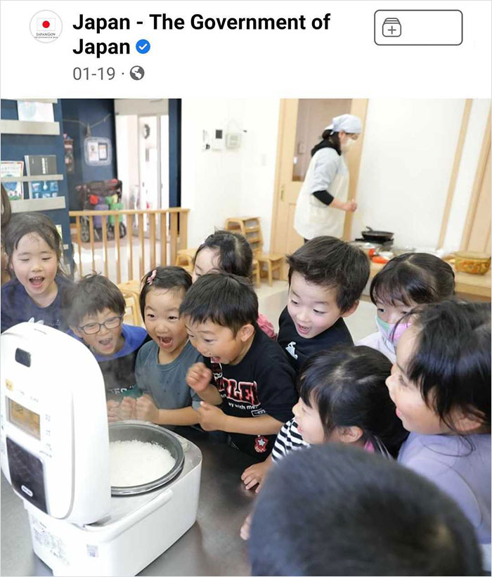 Group of excited children watching a steaming rice cooker, illustrating weird things spotted on official social media accounts.