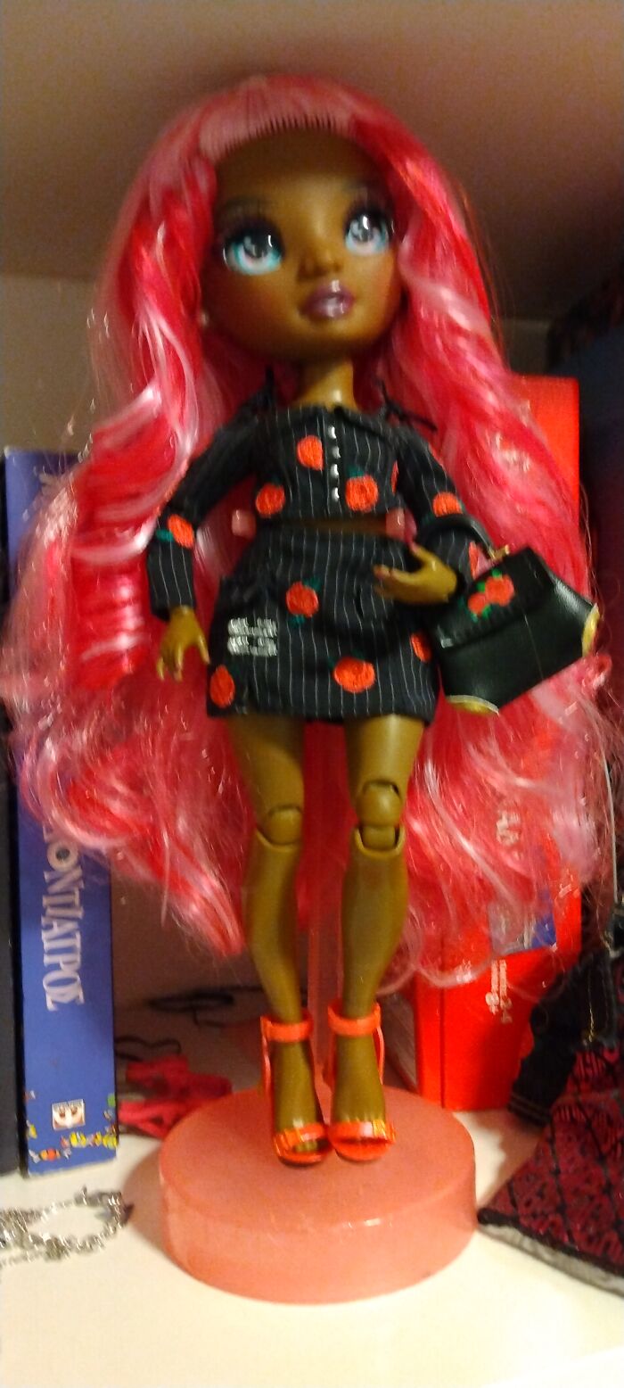 This Doll On My Book Self. One Of My Friends Asked Me How I Sleep At Night With "That" Across My Bed. A Lot Of People Think It's Creep Bit I Think She's Pretty