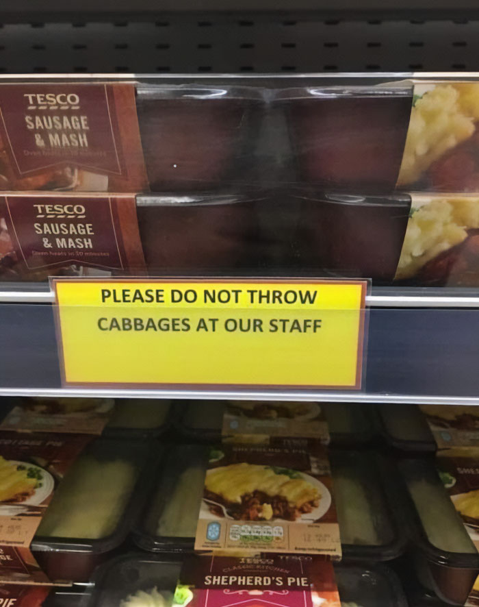 Hilarious and absurd sign in Tesco asks customers not to throw cabbages at staff near ready meals shelf.