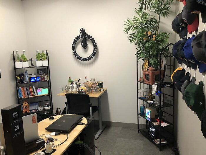 Office workspace with desk, laptop, shelves, and hats, illustrating things that are big scams many people don't realize.