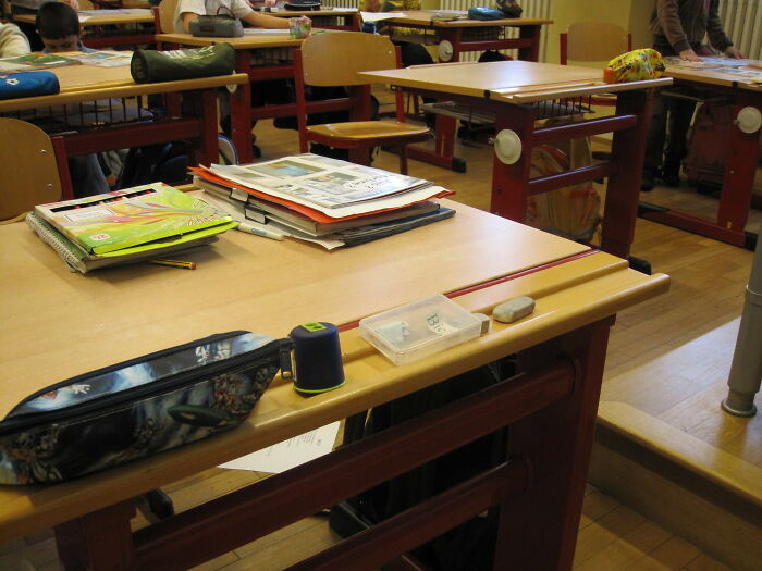 Classroom desks with school supplies, highlighting common items involved in big scams many people don’t realize.