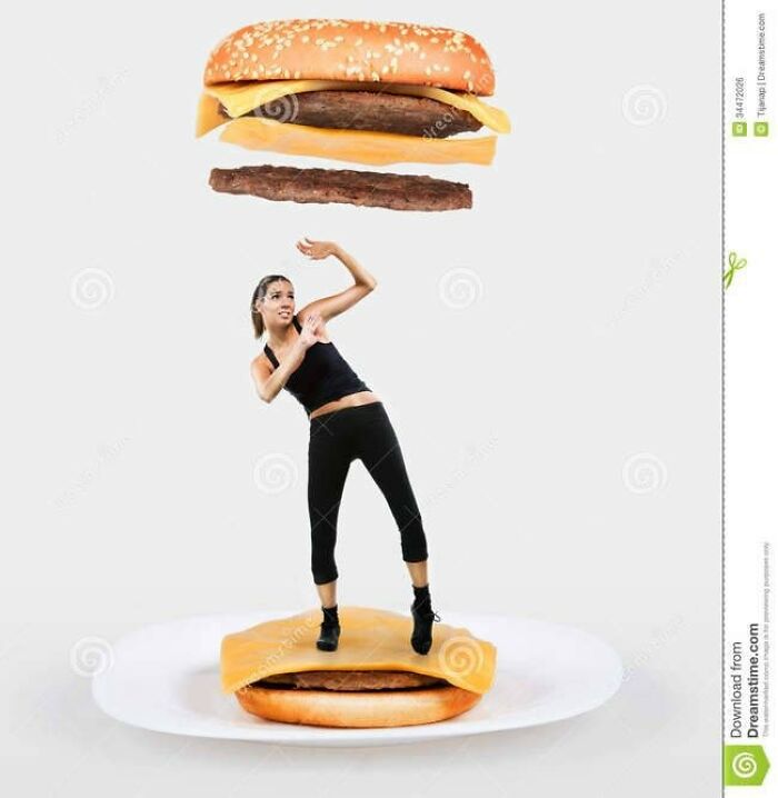 Dancing woman on giant burger bun with floating patty above. Weird stock image concept.