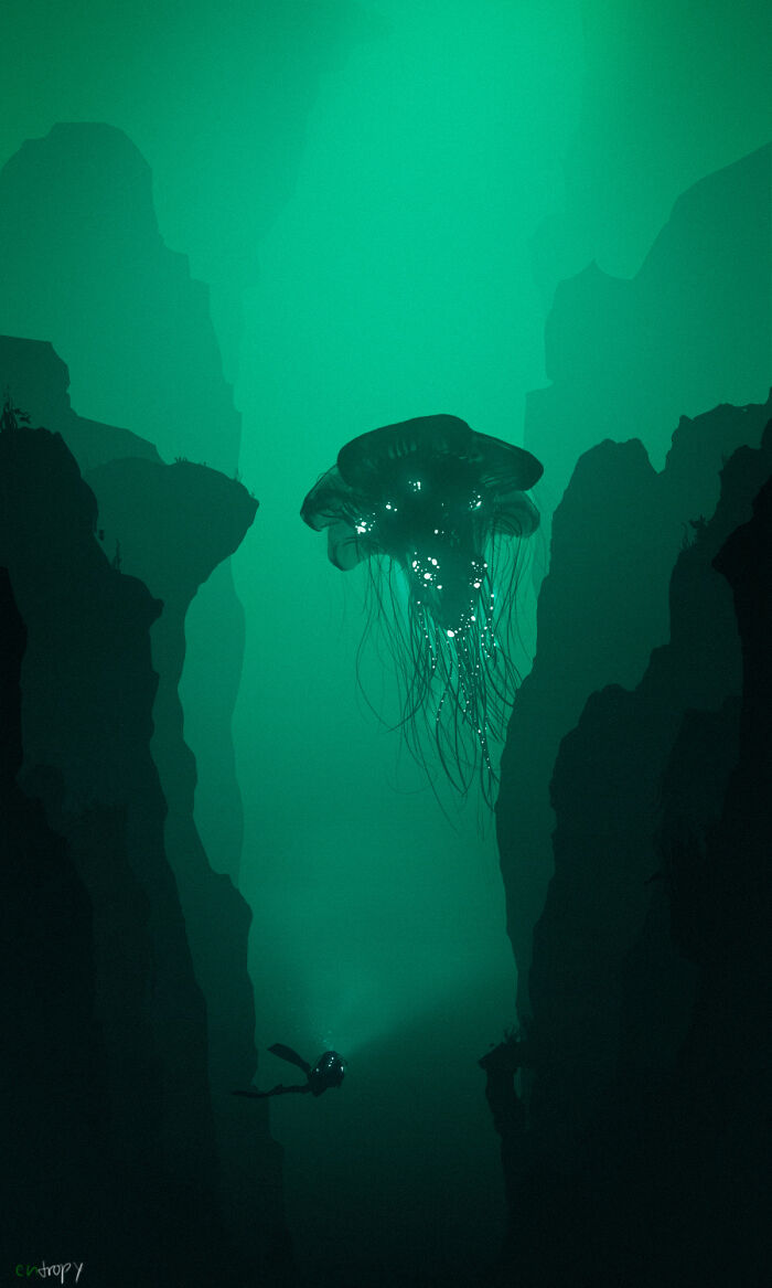 Diver shining light in deep water canyon near glowing jellyfish, evoking fear of deep waters and thalassophobia.