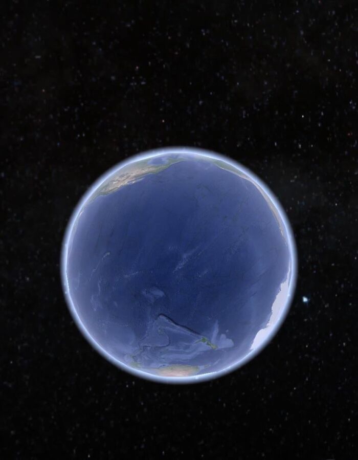 View of Earth from space highlighting the vast deep waters of the Pacific Ocean to trigger thalassophobia.