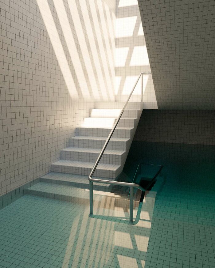 Empty tiled pool with stairs descending into deep turquoise water, evoking thalassophobia and fear of deep waters.