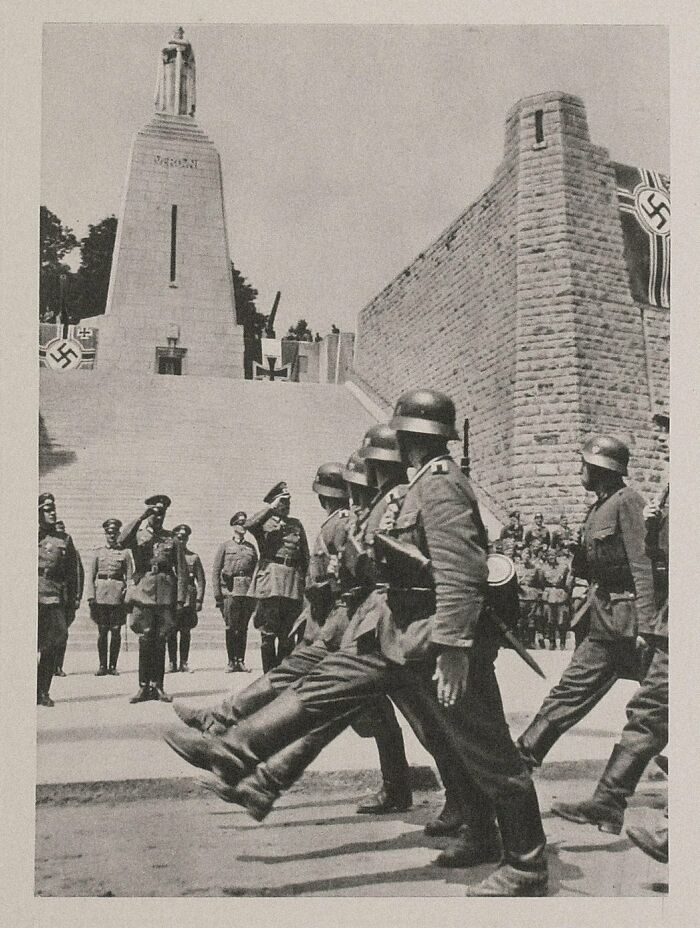 German Soldiers March Triumphantly Past The French Wwi Victory Monument In Verdun During The Fall Of France, 1940 
