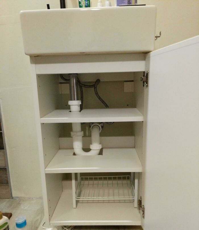 My IKEA Cabinet Wasn't Going To Have Shelving Because Of My Plumbing So I Just Cut Around It And I Got Two Shelves!