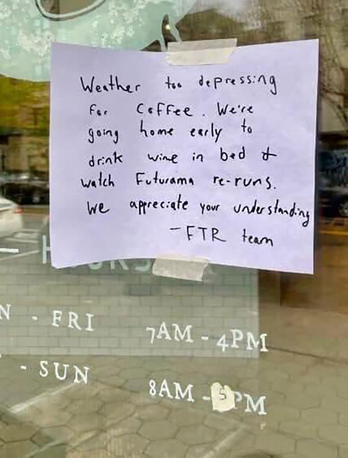 Handwritten funny sign on a window about closing early due to depressing weather, showcasing hilarious and absurd signs.