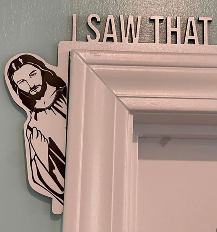 Cartoon Jesus peeking around a doorframe below a humorous sign saying I saw that, featured in hilarious absurd signs collection.
