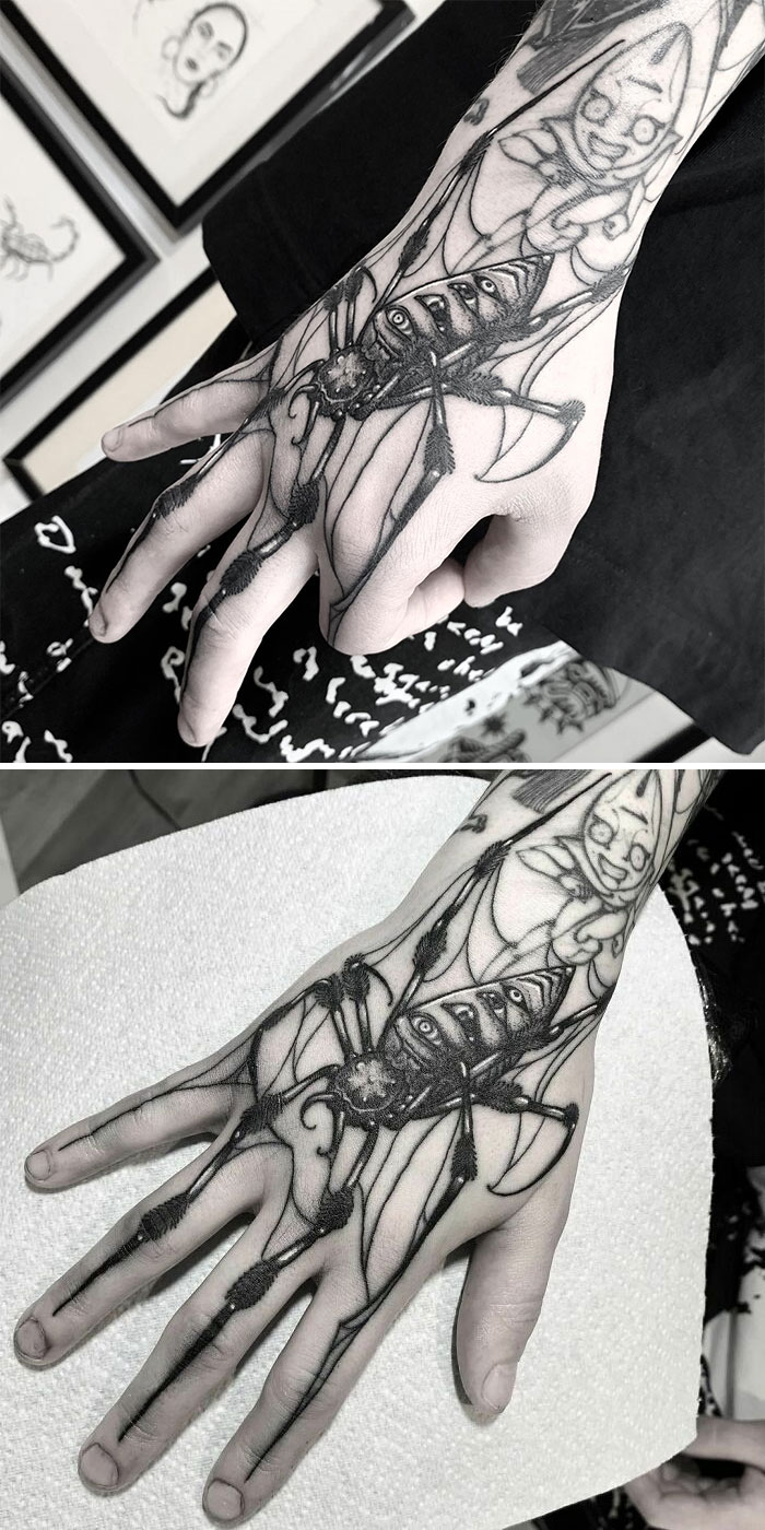 Intricate hand tattoo reveals design's full glory when hand moves, showcasing genius tattoo artistry.