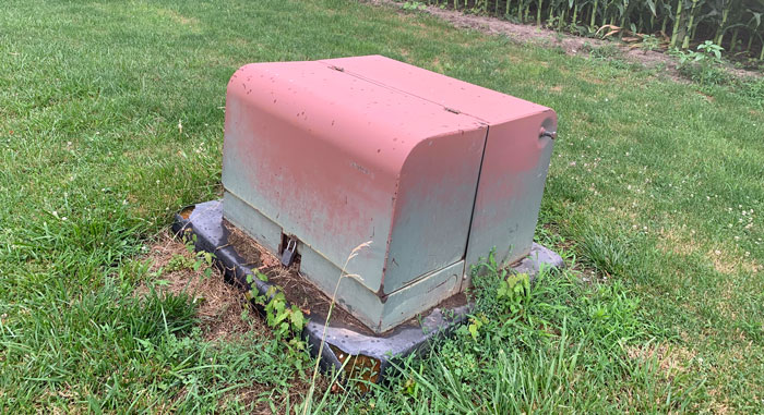 Humming Metal Locked Box Next To A Corn Field