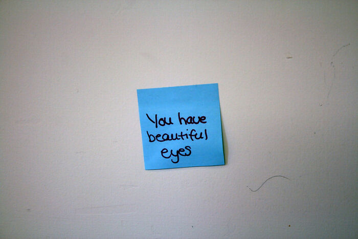 Blue sticky note with a handwritten message found as a startling windshield note in an online community collection.