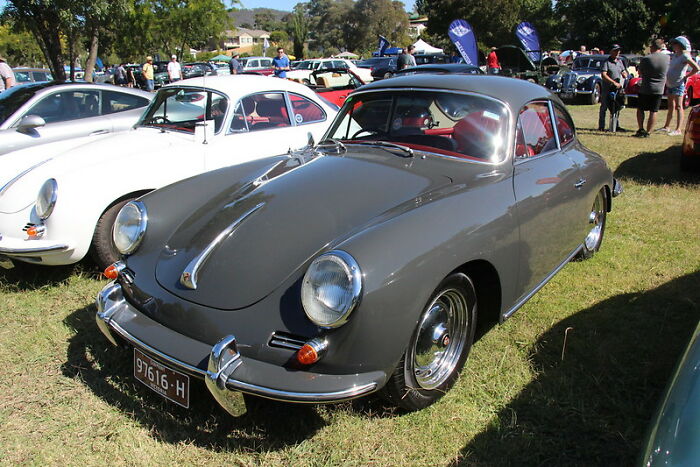 Classic gray car parked at a car show with windshield notes, showcasing some of the most startling windshield notes found by folks.