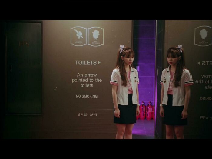 An Arrow Pointed To The Toilets