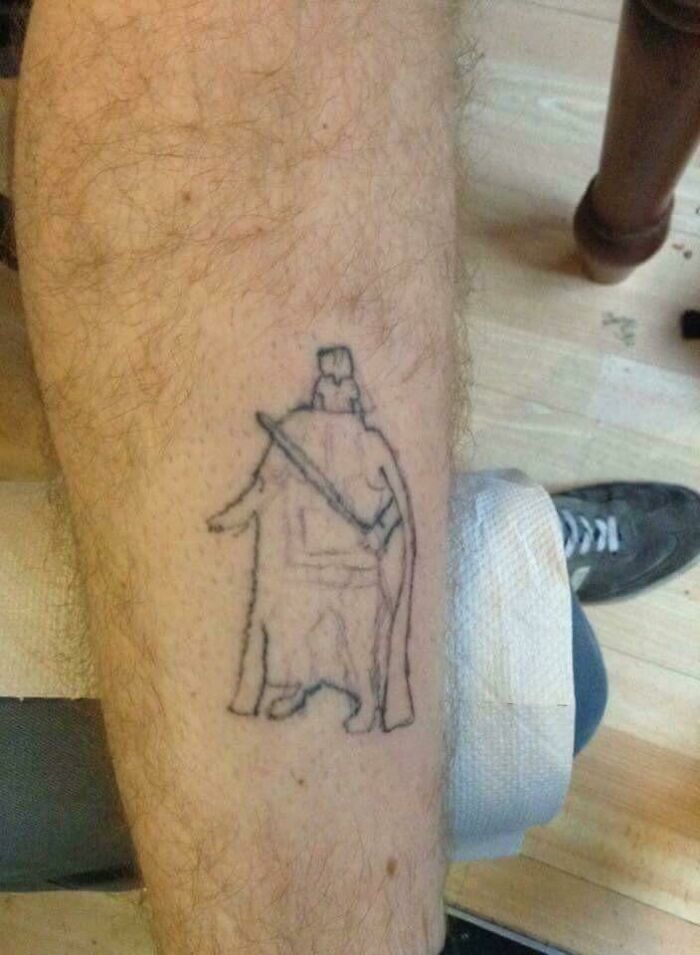 Badly done tattoo on leg with an incomplete figure, featured in a dedicated online group for worst tattoos.