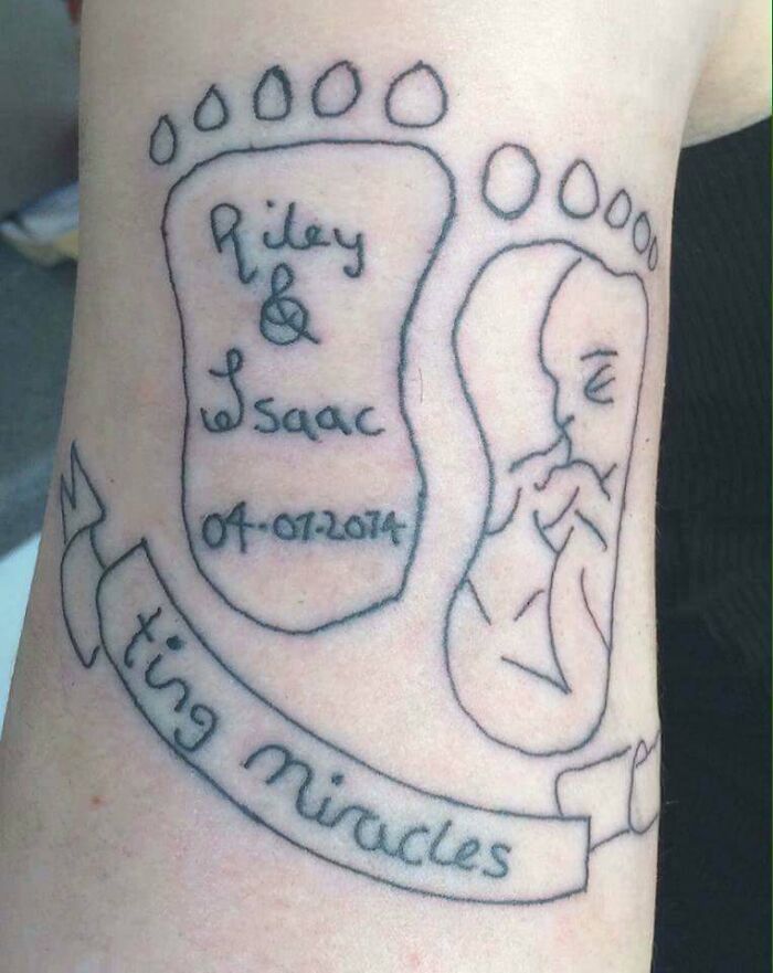 Poorly drawn tattoo featuring baby feet, names, and date, symbolizing regrettable tattoo art.