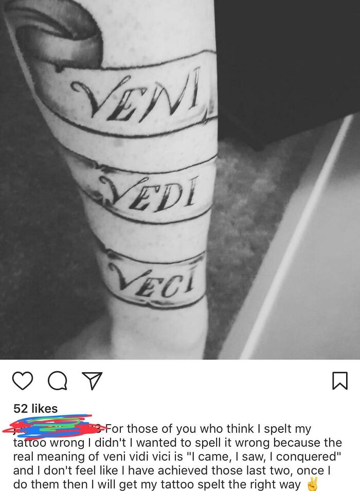 "Misspelled 'Veni Vidi Vici' tattoo in black ink on skin, displaying humorous pride in mistake."