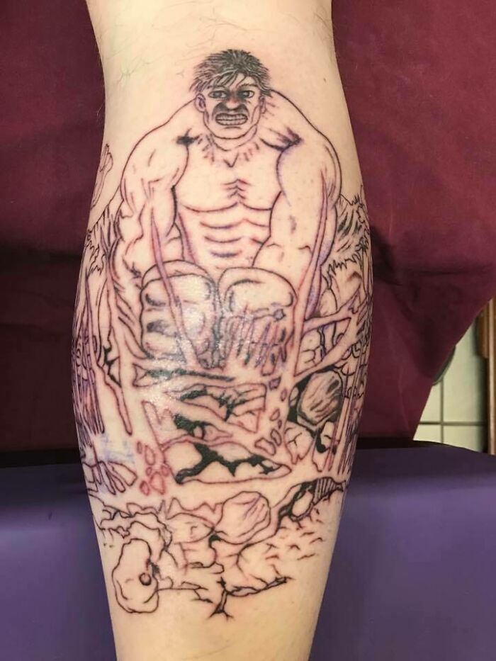 Poorly-done tattoo depicting a muscular figure in a chaotic scene on a person's leg.