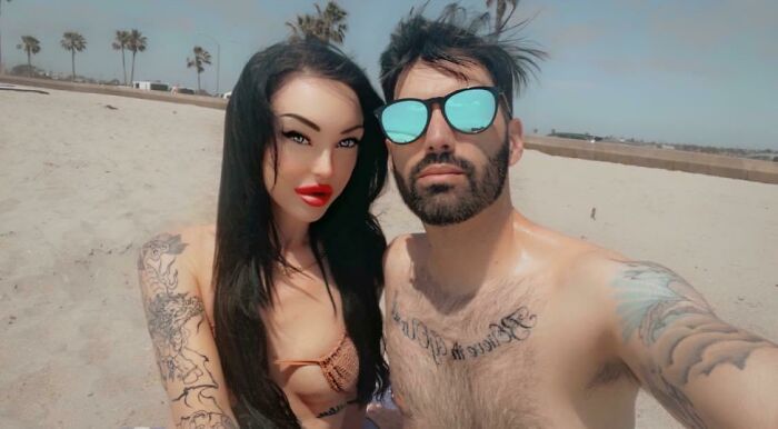 Couple posing on beach with exaggerated features, illustrating Instagram reality community exposing fakest photos online.