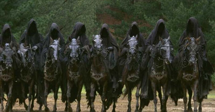 Ringwraiths on horseback in dark cloaks from a popular film, highlighting Easter eggs and hidden film details.