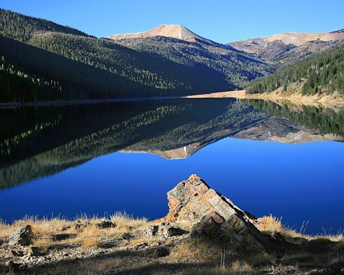 A Private Camp Lake In Wyoming. Down The Hill There Were Giant Red And Yellow Demoiselles Rock Pillars.
