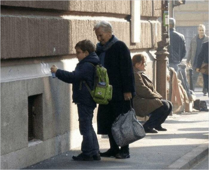 Grandma Approving Of Grandson's Artistic Skills