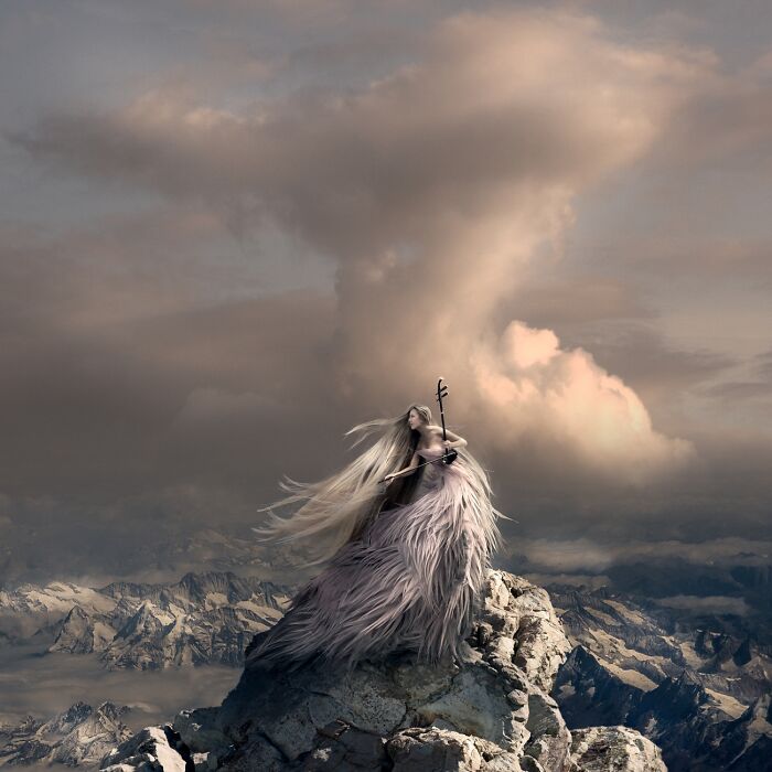 Surreal powerful photography of a woman in a flowing dress playing a violin on a mountain peak under dramatic skies.