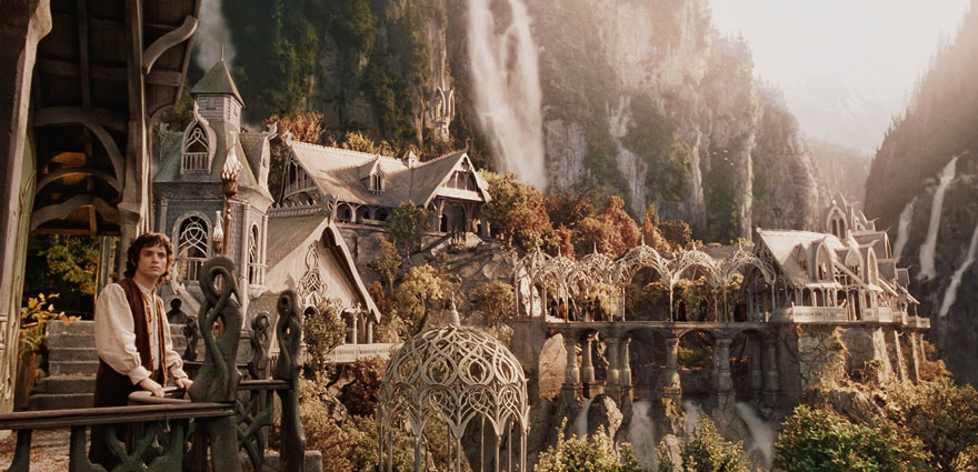 Frodo Baggins standing on the balcony in mountain city