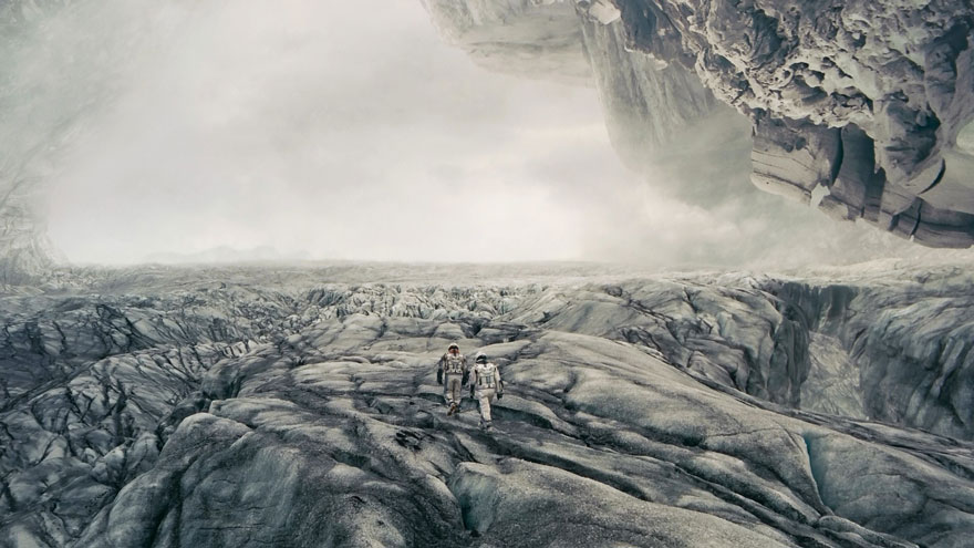 Two men walking in a unreal rocky place