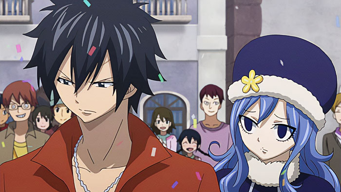 Cute anime couple in a festive setting with confetti falling, surrounded by onlookers in casual attire.