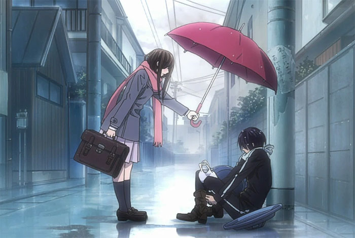 Anime couple in a rainy street, the girl offering an umbrella to the boy sitting down.