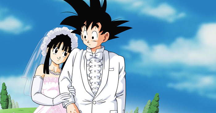 Anime couple in wedding attire, embracing under a clear blue sky.