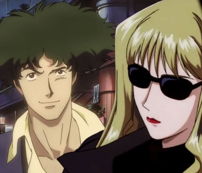 Anime couple in a city setting, one smiling with wavy hair, and the other wearing sunglasses and a jacket.