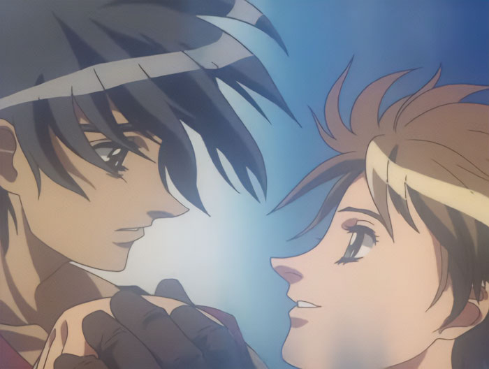 Anime couple gazing into each other’s eyes, surrounded by a soft blue background, representing one of the cutest anime pairs.