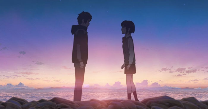Cute anime couple standing together at sunset, symbolizing a heartfelt moment.