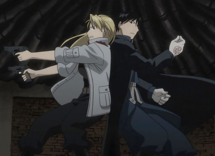 Anime couple standing back-to-back, each holding a weapon, in a dramatic pose from an action scene.