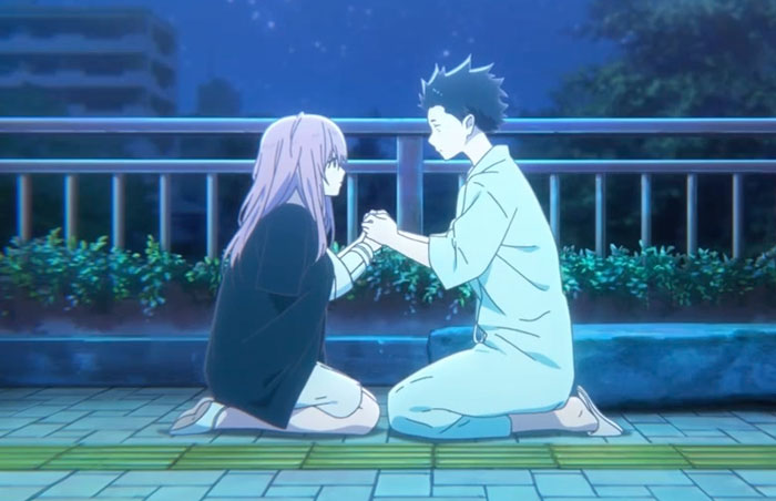 Anime couple holding hands on a moonlit path, illustrating a sweet and touching moment between them.