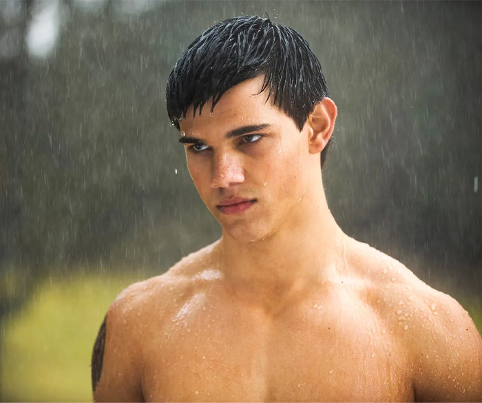 Jacob Black standing under the rain