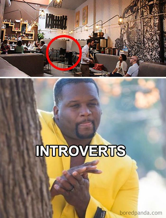 Man in yellow jacket rubbing hands and looking around a tree, representing introverts in relatable meme from Introvert Nation.