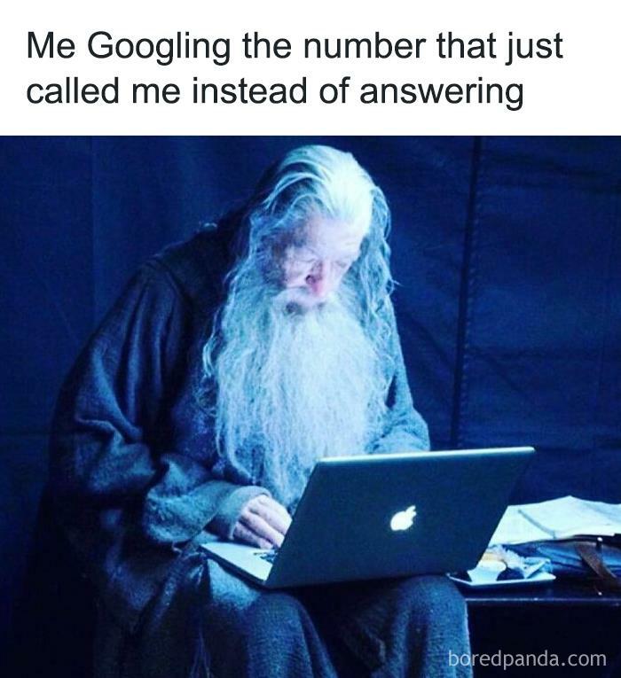 Elderly man with long white beard using laptop, representing introvert nation humor about avoiding phone calls.