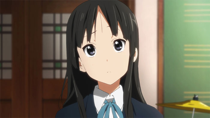 Female anime character with long black hair and a blue ribbon, standing in a room with traditional decor.